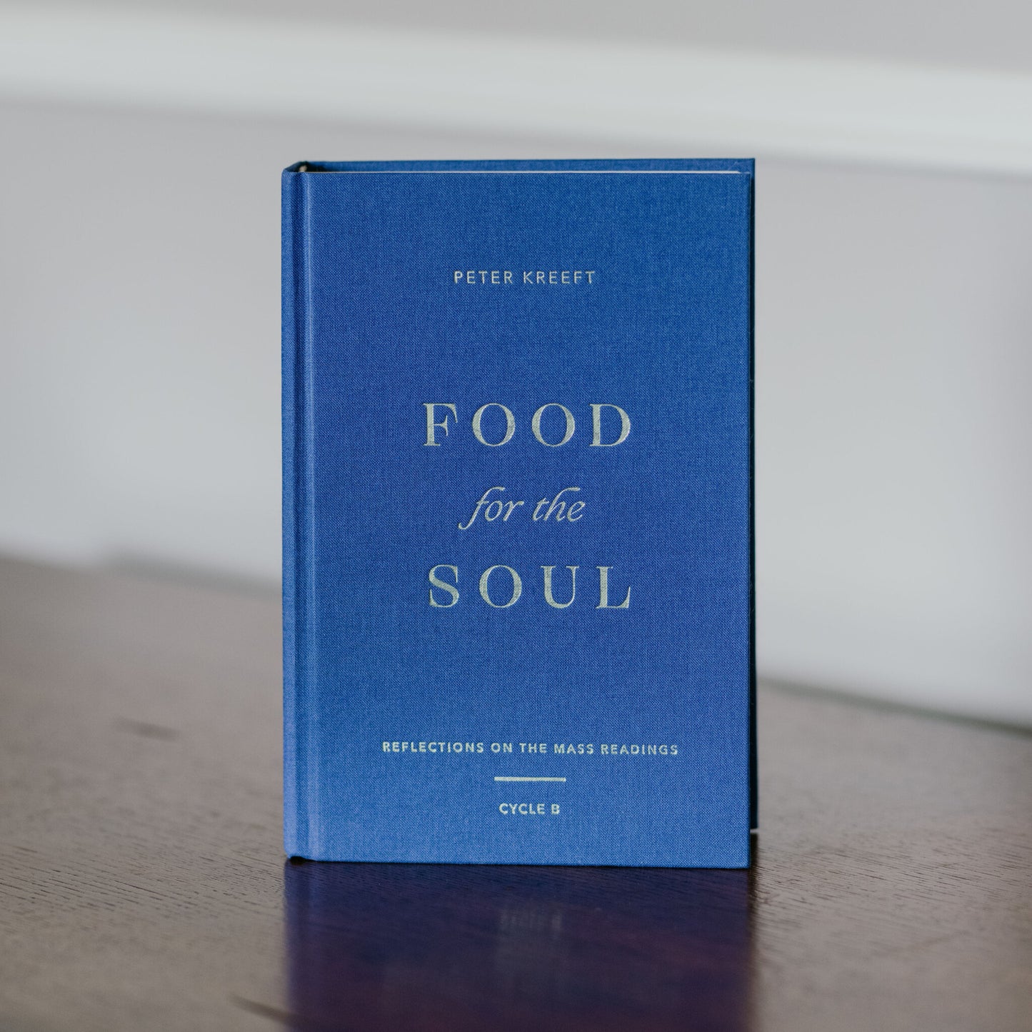 Food for the Soul - Cycle B by Peter Kreeft, a blue hardcover Catholic theology book focused on reflections for spiritual growth and evangelization, daily reflections on the Mass readings by Peter Kreeft
