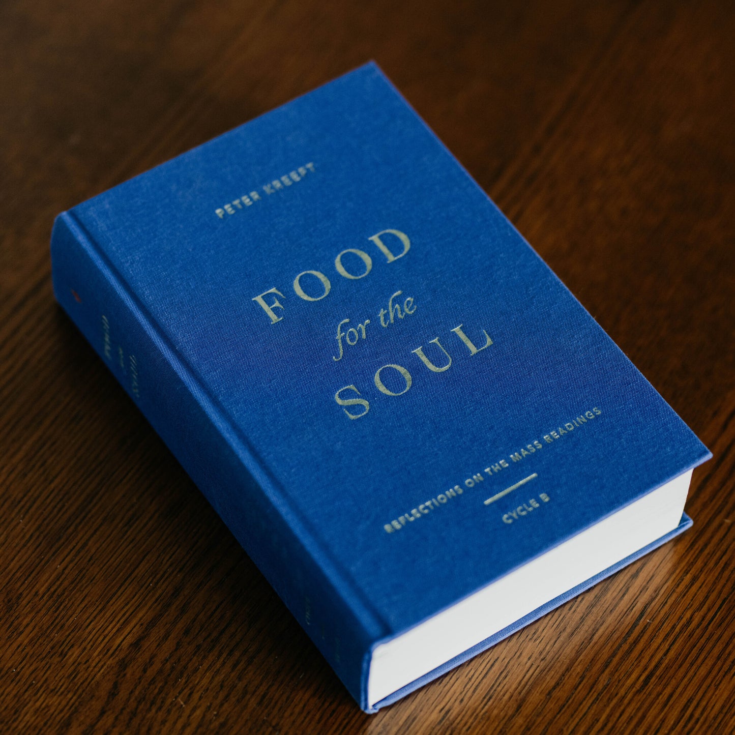 Food for the Soul - Cycle B book with blue hardcover and gold lettering by contributor Peter Kreeft, daily reflections on the Mass readings