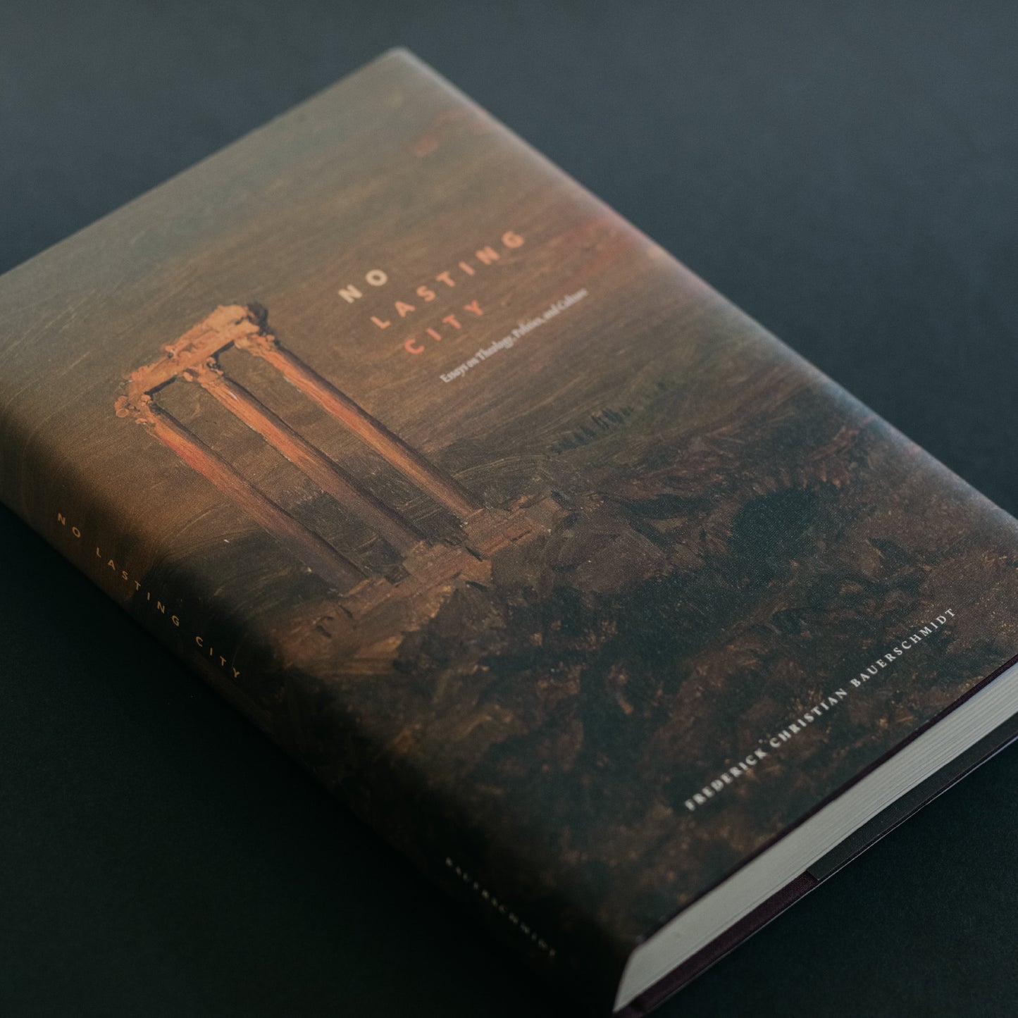 Book titled No Lasting City by Frederic Christian Bauerschmidt, a theology book published by Word on Fire, featuring an ancient ruins design on the cover, suitable for adult readers, Word on Fire Academic, hardcover 9781685780463