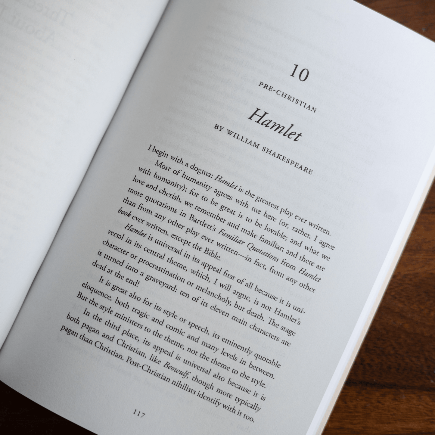 Open book showing a page titled "Hamlet" from "God on Stage: 15 Plays That Ask the Big Questions," featuring an introduction about the play by William Shakespeare with commentary on its themes and style, paperback 9781685781026