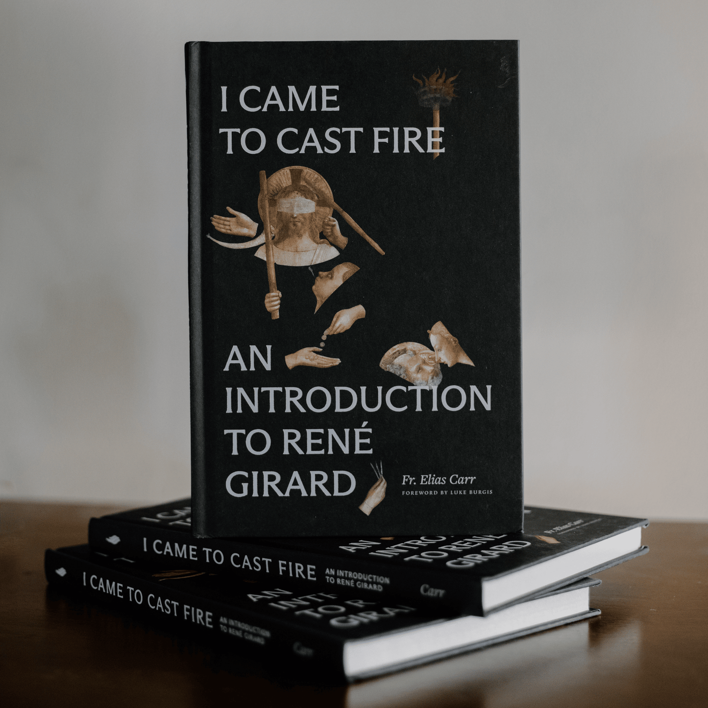 I Came to Cast Fire, black hardcover book featuring religious-themed artwork and the title "An Introduction to René Girard" by Fr. Elias Carr, book on mimetic theory, anthropology, hardcover 9781685781668