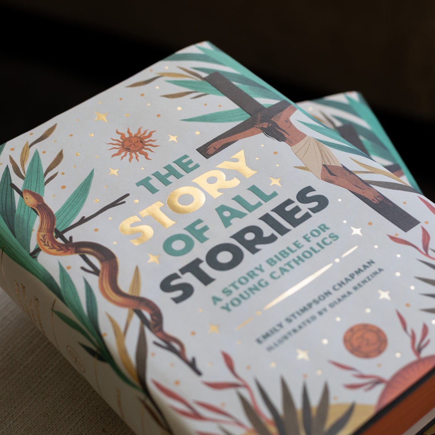 The Story of All Stories book cover with religious illustrations for young Catholics spiritual growth, great for Catholic gifts for kids, by Emily Stimpson Chapman, illustrated Catholic children's bible, suitable for children ages 7-13, hardcover 9781685782214