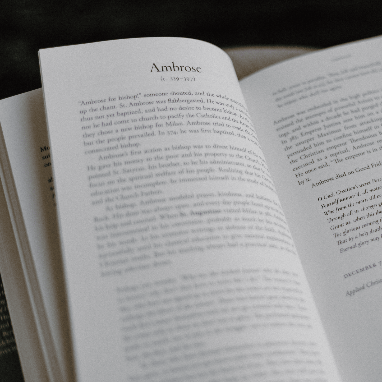 An open book showing a passage about Saint Ambrose, part of the Catholic spiritual book Voices of the Saints: A 365-Day Journey, daily devotional for Catholics, hardcover 9781685781163