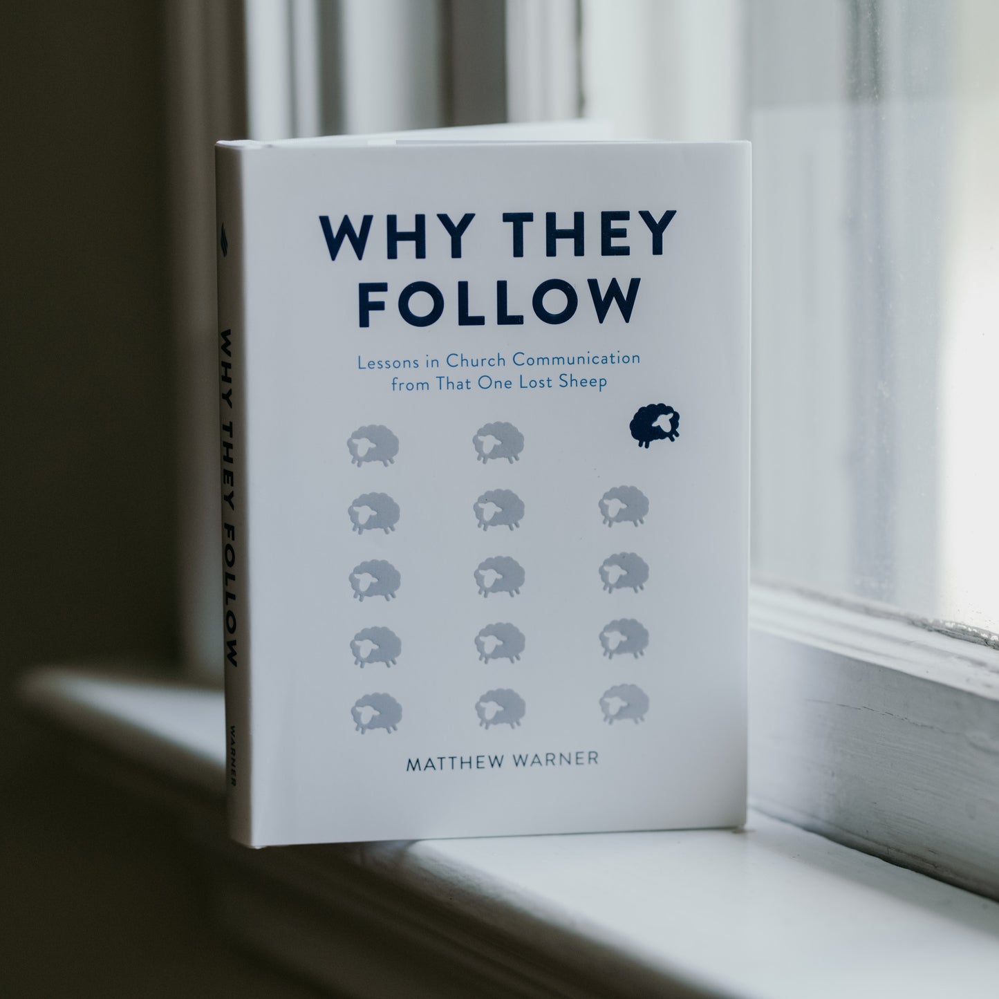 Why They Follow by Matthew Warner, a white book with blue text and sheep illustrations, focused on church communication and evangelization for parishes, books for Catholic parishes, hardcover 9781685780401