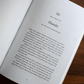Open book showing a page titled "Hamlet" from "God on Stage: 15 Plays That Ask the Big Questions," featuring an introduction about the play by William Shakespeare with commentary on its themes and style,  paperback 9781685781026