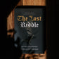 Book titled 'The Last Riddle' by Stephen Smith on a wooden surface