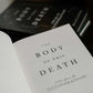 Open book page displaying the title "The Body of This Death" with handwritten subtitle "Letters from the East Archbishop of Lancaster", hardcover 9781685782597