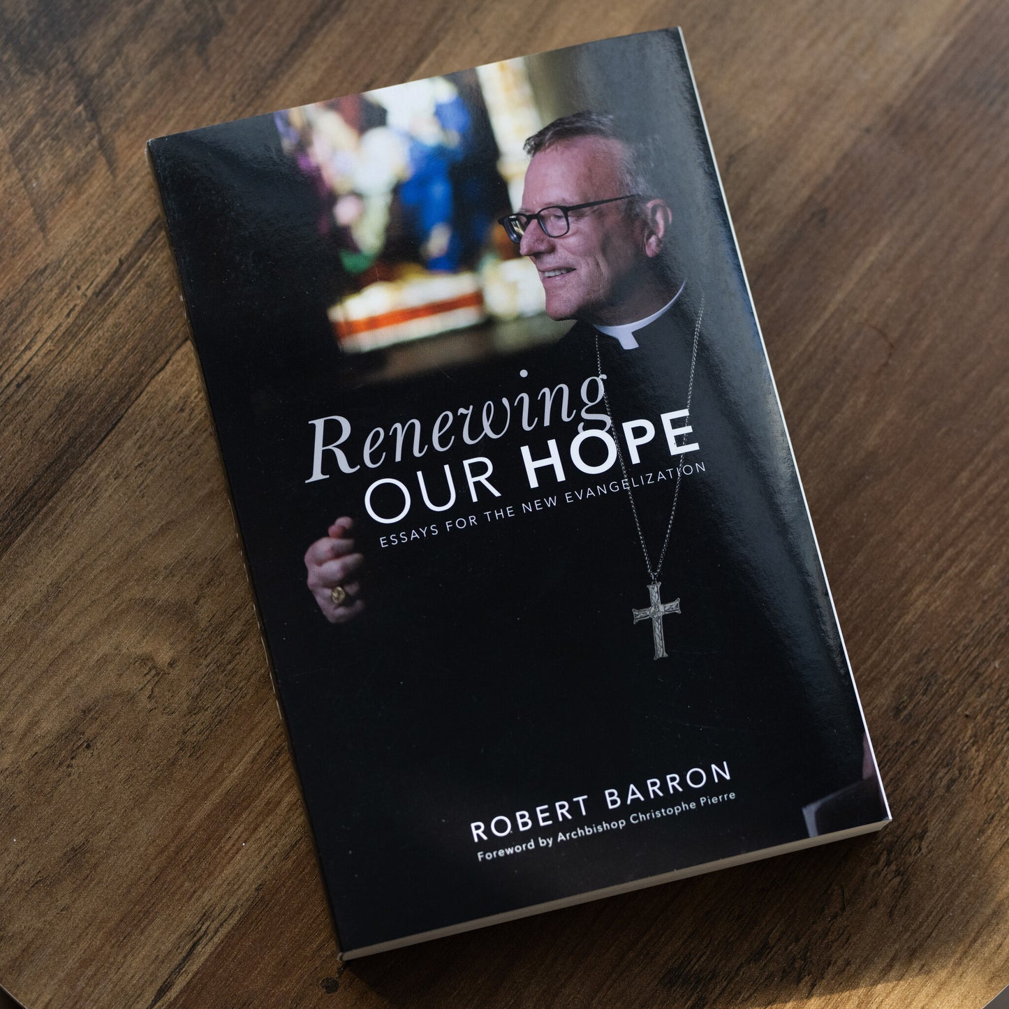 Book titled "Renewing Our Hope: Essays for the New Evangelization" by Robert Barron, with foreword by Archbishop Christophe Pierre, emphasizing Catholic spiritual growth and evangelization