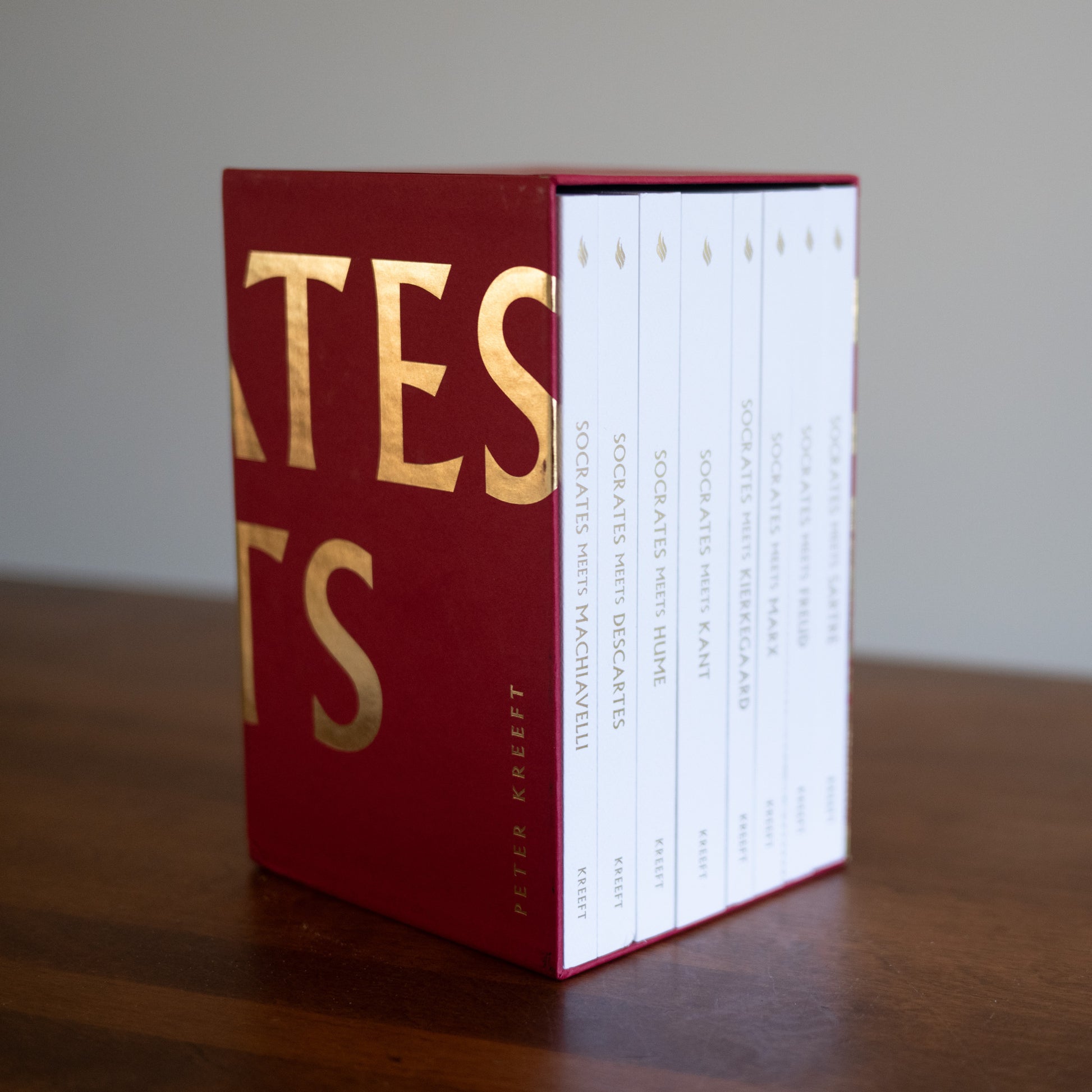 Socrates Meets Box Set featuring red box with gold lettering, by Peter Kreeft, 8 books included in the box set