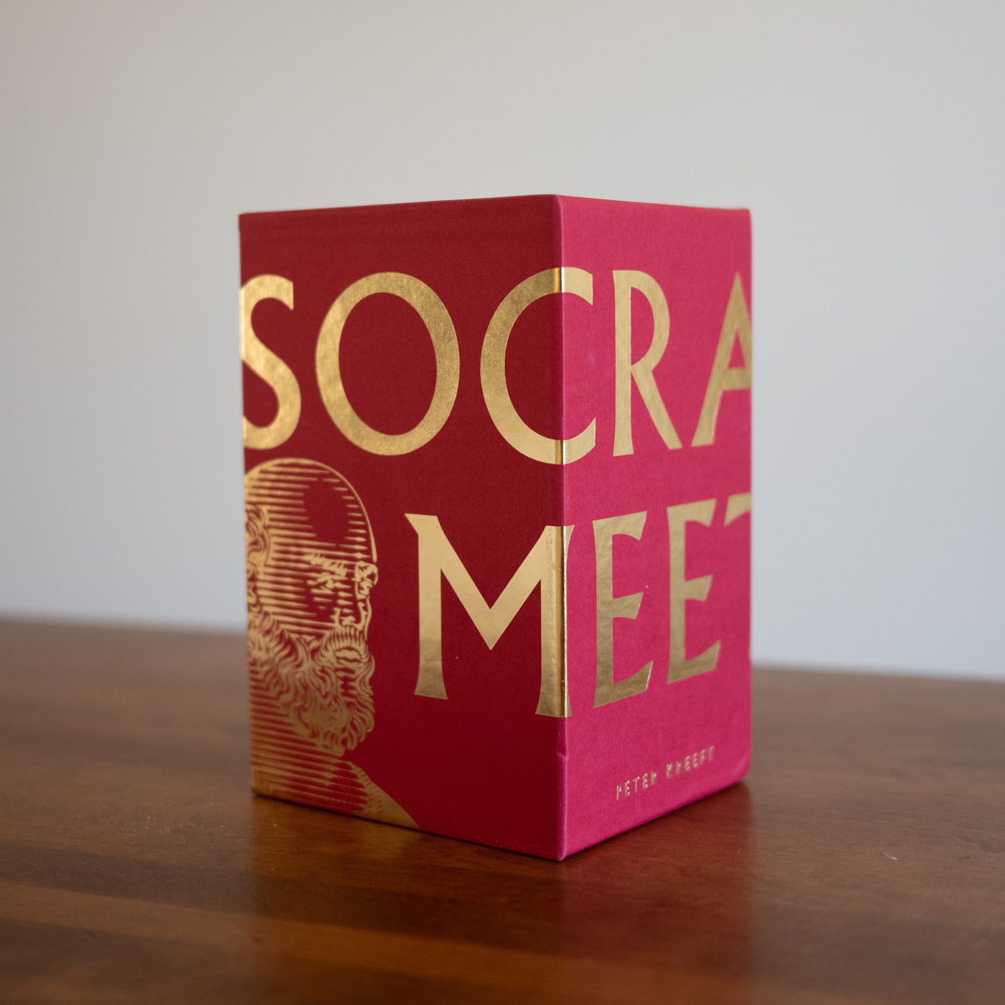 Socrates Meets Box Set with red cover and gold lettering, featuring an illustration of Socrates, by Peter Kreeft