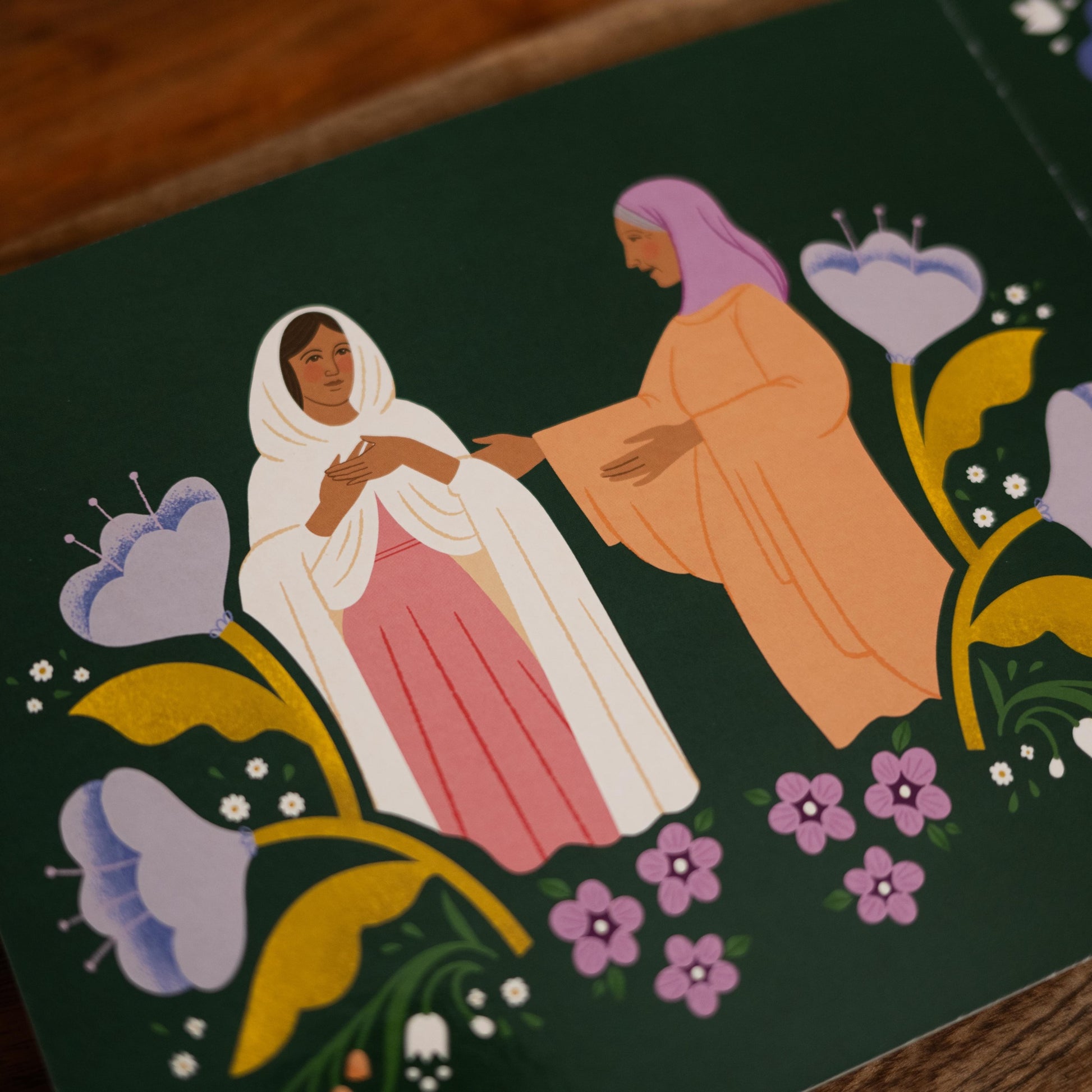 Illustration from Magnificat Canticle of Mary featuring the visitation of Mary to her cousin Elizabeth, biblical scene surrounded by purple and white flowers, for babies and toddlers ages 1-5, board book 9781685781521