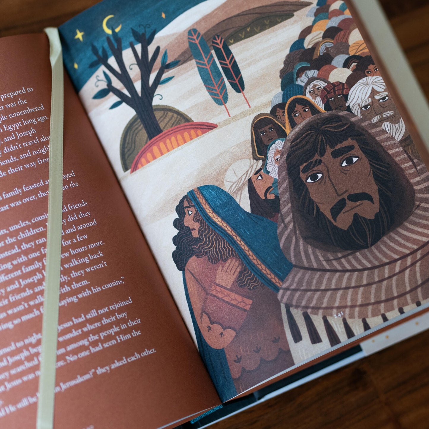 The Story of All Stories book open to an illustrated page showing biblical characters under a night sky with text on the left page, by Emily Stimpson Chapman, illustrated Catholic children's bible, suitable for children ages 7-13, hardcover 9781685782214 