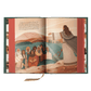 Open book "The Story of All Stories" showing illustrated biblical scene with Jesus teaching a diverse group of people, by Emily Stimpson Chapman, illustrated Catholic children's bible, suitable for children ages 7-13, hardcover 9781685782214 