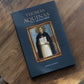 Thomas Aquinas: Spiritual Master book cover on a wooden table, published by Word on Fire Academic, written by Bishop Robert Barron, theology book for Catholics, hardcover 9781943243792