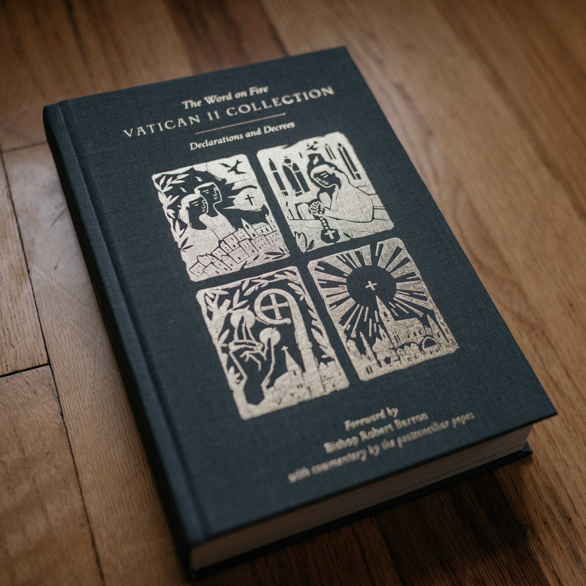 The Word on Fire Vatican II Collection: Declarations and Decrees book with a dark cloth cover featuring gold embossed religious illustrations, foreword by Bishop Robert Barron, hardcover 9781685780135