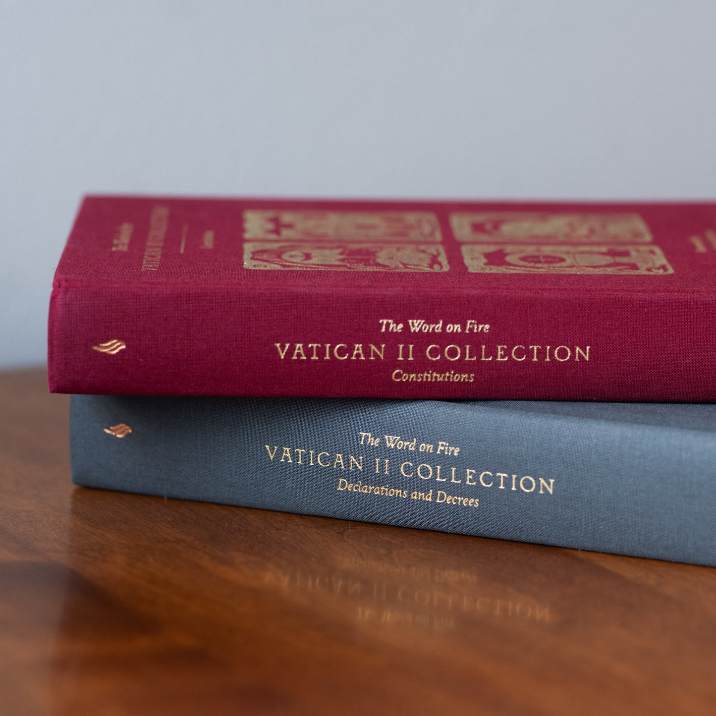 The Vatican II Bundle featuring two hardcover books with cloth covers in green and blue, titled "Vatican II Collection: Declarations and Decrees" and "Vatican II Collection: Constitutions", foreword by Bishop Robert Barron, edited by Matthew Levering
